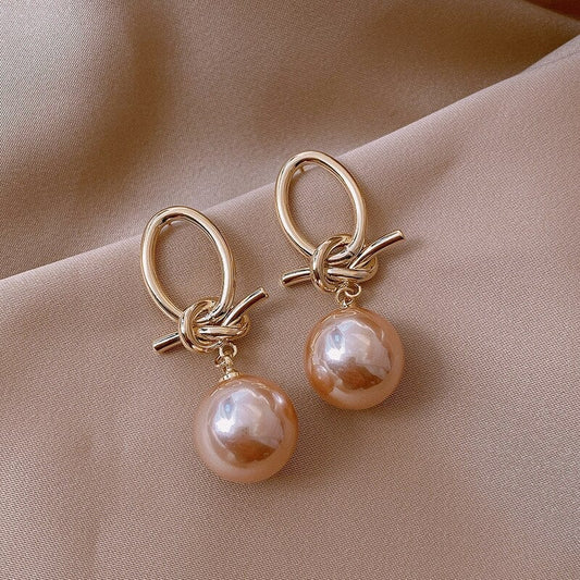 Champagne Pearl Drop Earrings with Knot Detail in Gold Tone