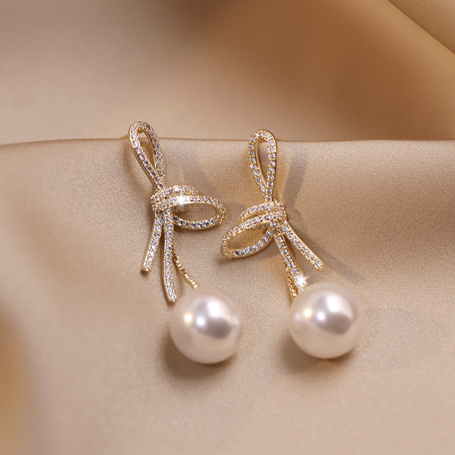 Crystal Bow Pearl Drop Earrings in Gold Tone